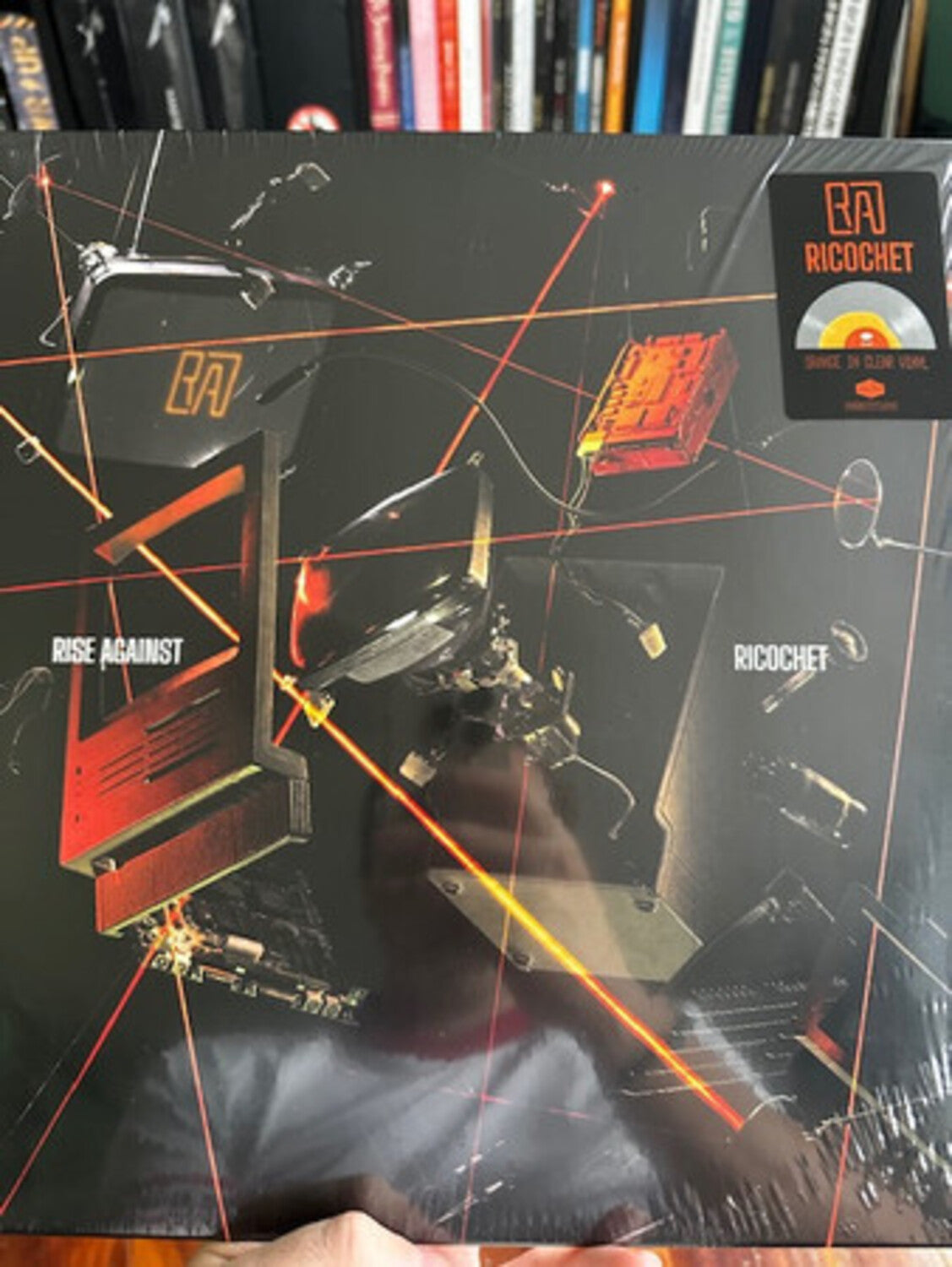 Rise Against - Ricochet - Limited Colored Vinyl with Opaque Orange Center & Clear Outside (Orange Vinyl)